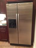 Kitchen Aid stainless steel refrigerator with ice and water on the door, 36" width