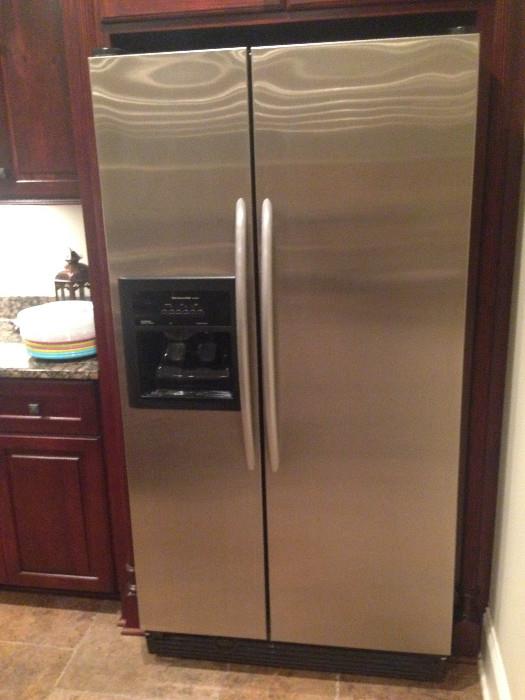 Kitchen Aid stainless steel refrigerator with ice and water on the door, 36" width