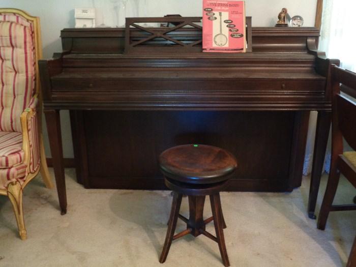 Upright piano with stool in working order 