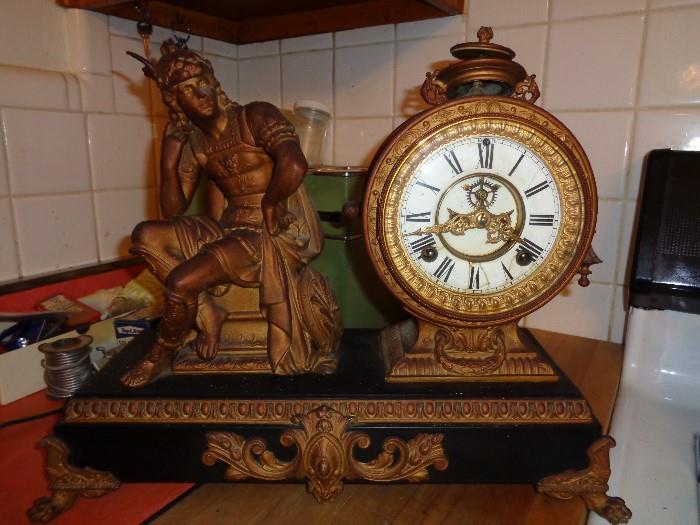 Good working condition Ansonia Clock featuring Mercury seated. Both keys to wind clock, pendulum is in place and work.  17 inches wide and 14 inches tall. Mercury is missing 1 wing from his helmet, the side accent is missing and the top finial appears to be loose. markings in place 1882 