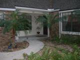 Beautiful Brick Home within lovely landscaping plenty of privacy and quiet neighborhood