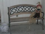 Seasonal Scarecrow on Metal and Wood Bench