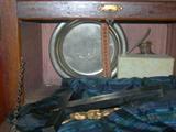 Interior Detail Illustrating Accessories: Crucifix, Monogrammed Plate, Holy Water Glass Bottle and Collar