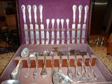 Silver Plate by Reed & Barton, "Modern Art" circa 1904:  Knives (7); Butter (5); Master Butter (1);  Tablespoons (9); Small Ladle (1); Teaspoons (5); Soup Spoons (7); Grapefruit Spoons (7); Serving Spoons (2); Pierced Bon Bon (1); Large Pieced Ice Spoon (1)