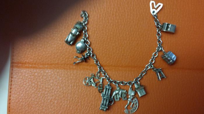 sterling charm bracelet some with moveable parts35.6g