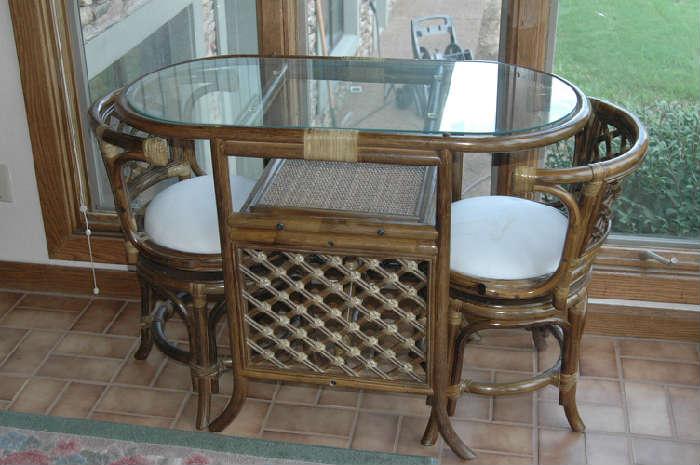 Rattan table and two chairs.. Honeymoon table?