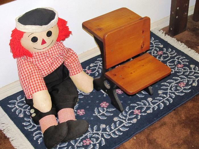 Vintage Doll Student Desk Seat with light finish, metal frame and wood seat; Also shown is a vintage Raggedy Doll , and a small oriental style throw rug which are also available.