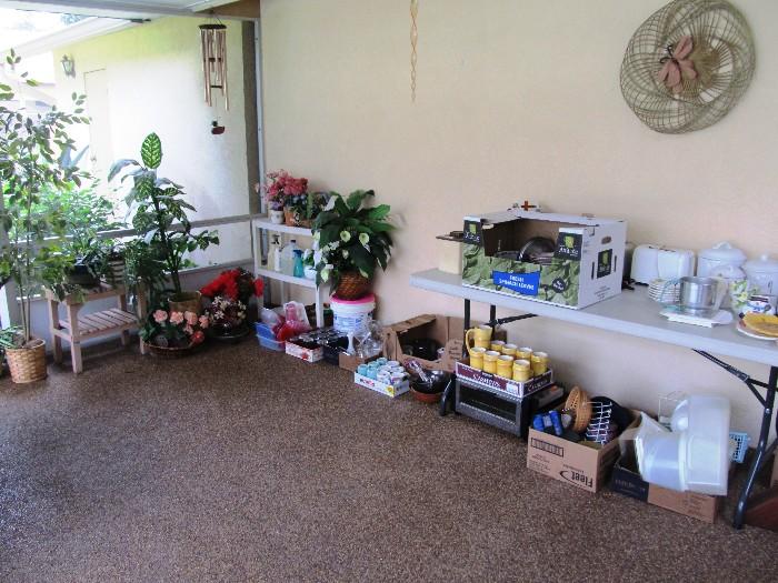 Some of the decorator pots & potted plants...live and artificials available in this sale.  Also plant stands and shelf unit shown are available; Also shown are some of the kitchenwares and tablewares that are available in this sale