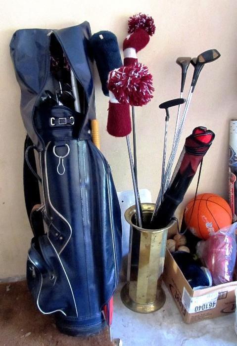 Golfing Equipment ...Golf Bag with set of golf clubs...irons, woods, balls, golfing accessories; Brass Umbrella holder; Also shown are some of the sports / recreation equipment available.