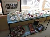 LARGE ASSORTMENT OF TEA CUPS - METAL AND GLASS SOFA TABLE
