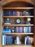 Library-Bookcase Three:  Books; brass giraffe; globes; clock; various décor.