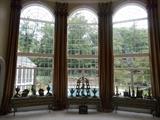 Living Room:  A view of the three tall arch windows that are the background for beautiful displayed décor.