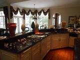 Kitchen:  Another view of the decorative items in the kitchen as well as flatware on the counter.