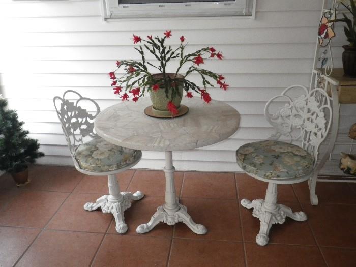 Cast iron chairs and table base, marble top table