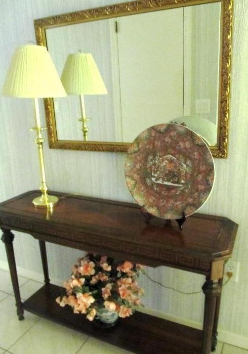 Vintage Traditional Style Sofa / Foyer Table  with rich finish, nicely carved spindled legs and lower shelf storage.  Sofa / Foyer Table is matching to Vintage Traditional Style Coffee Table,  and Vintage Traditional Style End Tables that are pictured elsewhere in this collection.  The Gilt framed Mirror, Brass Accent Table Lamp, accent platter, and vase with floral arrangement  shown are also available.