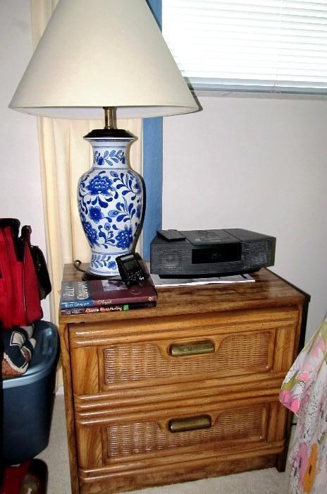 Night Stand part of First Family by Armstrong Collection,  with 2 drawers storage and basket weave accented fronts.  Night Stand is matching to  Armstrong Triple Dresser  which is pictured elsewhere in this collection.  Blue and White Ceramic Accent Table Lamp shown is also available