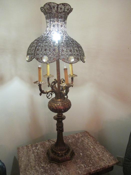 Tall Vintage Pierced Brass Banquet Lamp and shade with crystal prisms.  This can go well in a Moroccan, Turkish, or Italian themed look.   