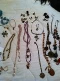 Many lariat necklaces in pearls, precious stones
