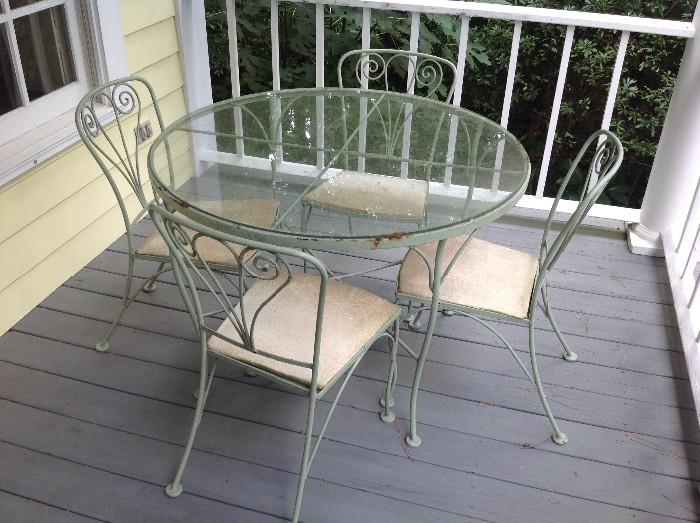 Glass top metal table / 4 Chairs $ 180.00
