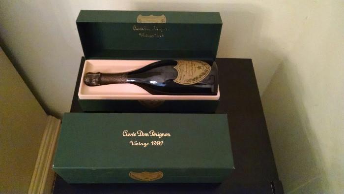 Two bottles of '92 Dom Perignon stored in a vino temp cooler in their original boxes