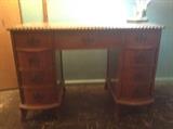 Solid wood desk with braided edge, curved feet, and nine fantastic dovetailed drawers