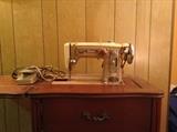 Wizard brand sewing machine in cabinet
