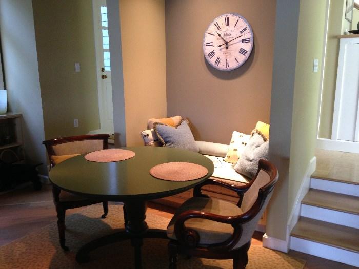 Table and chairs for sale, clock is not.