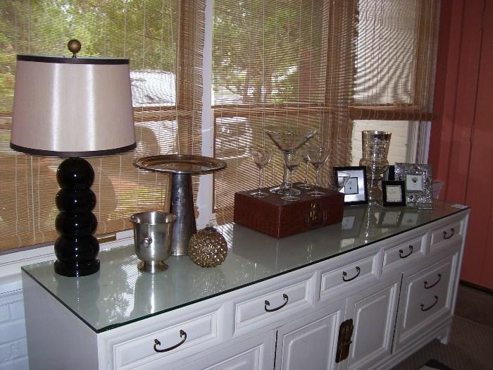 Ceramic table lamp, silver plate tall cake stand, suitcase with martini glasses and frames