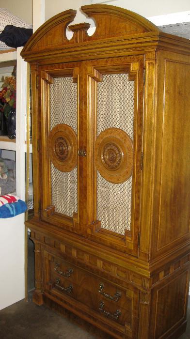 This is a very nice Wood cabinet with 3 drawers inside.