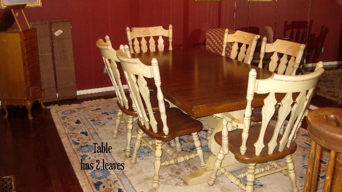 Very solid dining room table with (6) chairs and (2) leaves