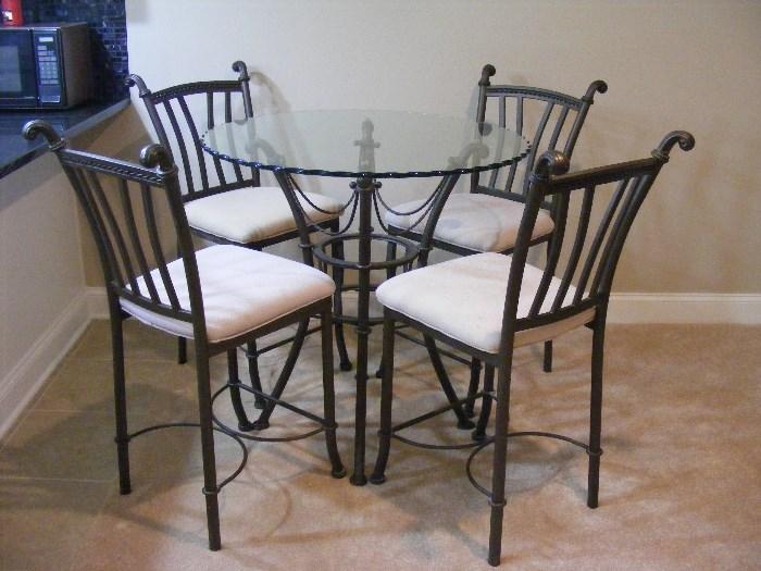 Glass top Bistro/Pub table with counter height wrought iron chairs