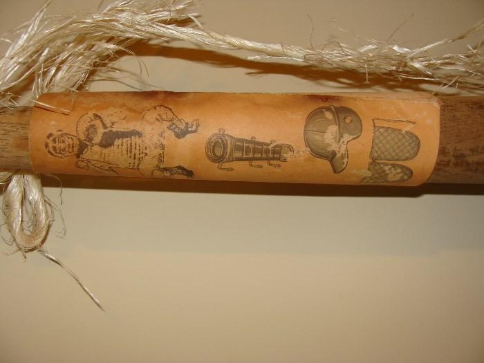 Antique wooden baseball bats one with old drawings of various types of equipment available