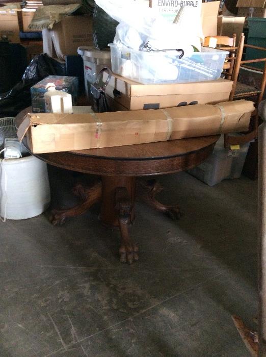 Dark oak claw foot table in good condition.