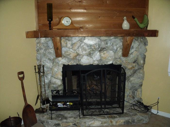 fireplace screen, tools and old hand-carved wooden shovel.  