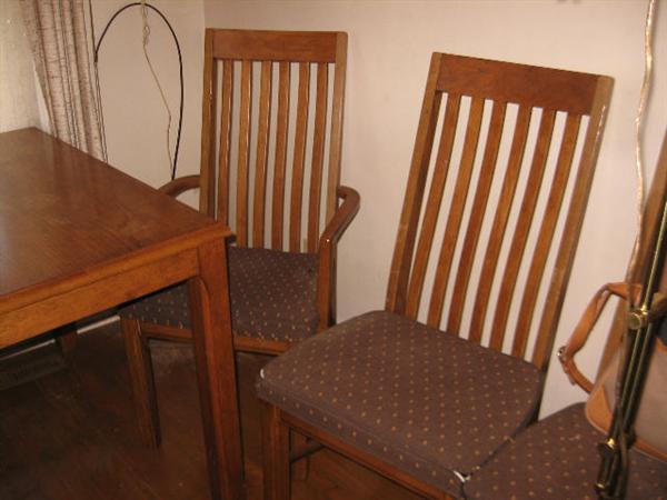 Wood Table and 2 Arm Chairs -  4 w/out arms -  1 needs repair