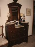 Victorian Dresser with drop center which has marble top - candle stands and mirror tilts!