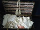 antique trunk full of doilies and old linens