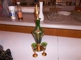 green glass brandy decanter with 2 glasses