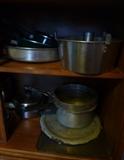 Miscellaneous pots and pans, griddle and cookie sheets.