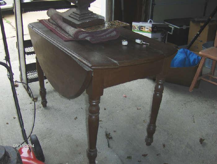 Drop leaf walnut table with extra leaves