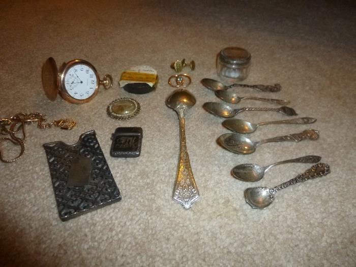 14K pocket watch....14K mason's 32nd fob with heavy plate chain, sterling calling card holder, mourning pin with hair....Tiffany & co spoon, and sterling spoons...this is just part of what is being found