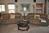 double reclining sofas, floor lamps, wall mirrors, rolling leather top table