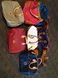 Authentic Dooney & Bourke purses. New with bags.