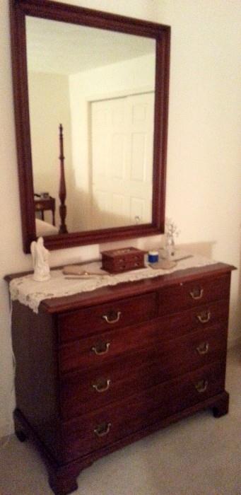 Henkel Harris cherry eight drawer chest with matching mirror.