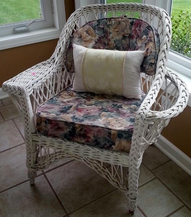 Bar Harbor wicker chair with a built in magazine pocket.