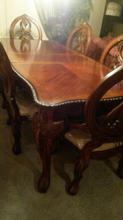 Thomasville cherrywood formal dining room table with six chairs. Plastic still on seat cushions in excellent condition