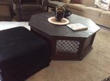 Black ottoman and skate topped coffee table. 