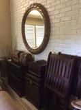 Neat wood folding chairs, bird cage, woven boxes and huge round mirror. 