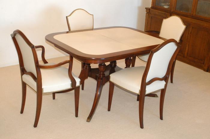 Dining room set by colonial manufacturing
 top grain leather top table custom finished with one leaf
2 captain chairs with arms with brass detailing
4 side chairs with brass detailing 
