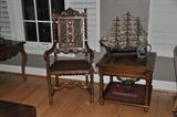 Antique carved mahogany and cane chair with vintage Hekman side table